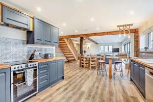 a kitchen with blue cabinets and a dining room at 3 Bed in Outwell oc-b28260 in Upwell