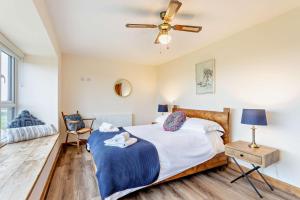 a bedroom with a bed and a ceiling fan at 3 Bed in Outwell oc-b28260 in Upwell