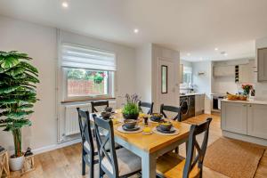 a kitchen and dining room with a table and chairs at 3 Bed in Acton oc-c28929 in Waldingfield