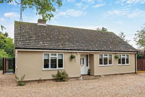 a small house sitting on top of a gravel driveway at 3 Bed in Acton oc-c28929 in Waldingfield