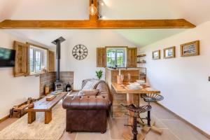 a living room with a couch and a table at 1 Bed in Okehampton oc-p29017 in Okehampton