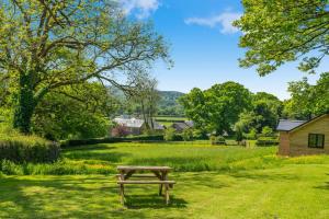a picnic table in the middle of a field at 1 Bed in Okehampton oc-p29017 in Okehampton
