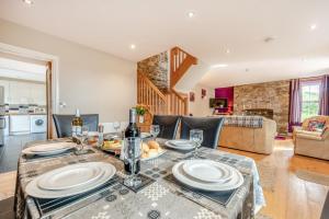 a dining room and living room with a table at 2 Bed in Llandysul oc-was280 in Rhyd Lewis