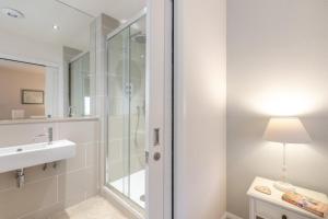 a bathroom with a shower and a sink at 2 Bed in Bamburgh oc-gd0462 in Bamburgh +24 photos