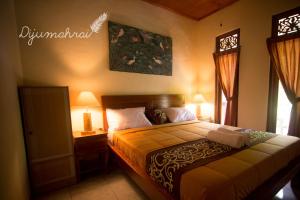 Postel nebo postele na pokoji v ubytování Dijumahrai Homestay