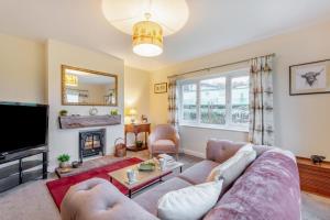 a living room with a couch and a tv at 2 Bed in Renwick oc-h34195 in Renwick