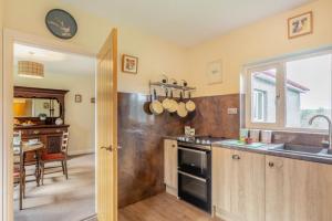 a kitchen with a sink and a stove at 2 Bed in Renwick oc-h34195 in Renwick +9 photos