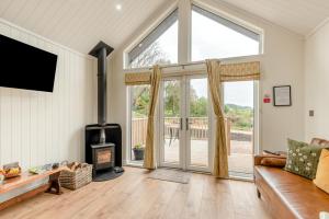 a living room with a couch and a fireplace at 2 Bed in Mouswald oc-b33444 in Mouswald