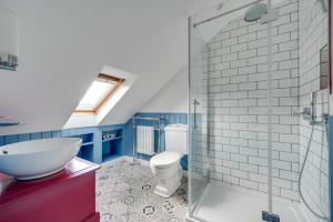 a bathroom with a toilet and a sink and a shower at 4 Bed in Halesworth oc-5river in Halesworth +5 photos