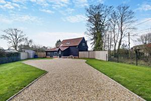 a driveway leading to a house in a yard at 2 Bed in Wickhambrook oc-b30507 in Wickhambrook