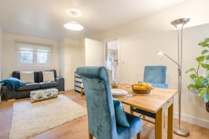 a dining room and living room with a table and chairs at 1 Bed in Rolvenden oc-c33657 in Rolvenden