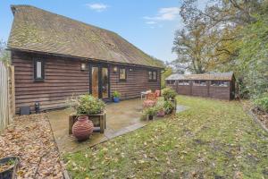 a house with a yard with a patio at 1 Bed in Rolvenden oc-c33657 in Rolvenden