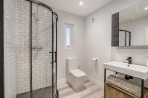 a bathroom with a shower and a toilet and a sink at 1 Bed in Rolvenden oc-c33657 in Rolvenden +15 photos
