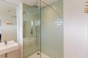 a bathroom with a glass shower stall and a sink at 3 Bed in Camber oc-s27568 in Camber +14 photos