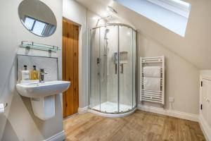 a bathroom with a shower and a sink at 2 Bed in Castleton oc-p34012 in Castleton +29 photos