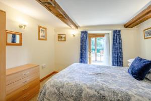 a bedroom with a bed and a window at 2 Bed in Smallburgh oc-m33732 in Dilham +22 photos