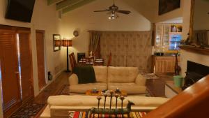 a living room with a couch and a fireplace at Artist Chalet in Flagstaff