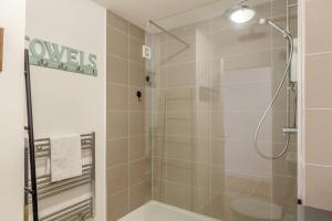 a shower with a glass door in a bathroom at 2 Bed in St. Ives oc-18stn in St Ives +21 photos
