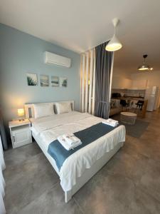 a bedroom with a large bed and a dining room at Caesar Resort & SPA - Apartments Studio in Iskele +92 photos