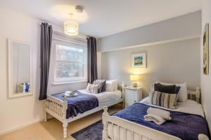 a bedroom with two beds and a window at 2 Bed in St. Ives oc-18stn in St Ives