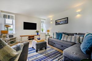 a living room with a couch and a tv at 3 Bed in Treknow oc-h29194 in Treknow