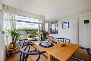 a dining room with a table and chairs and a window at 3 Bed in Treknow oc-h29194 in Treknow