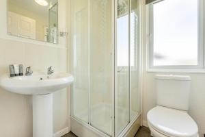a bathroom with a shower and a toilet and a sink at 3 Bed in St. Merryn oc-k30138 in Saint Merryn +22 photos