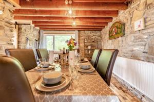 a dining room with a long table and chairs at 3 Bed in Port Talbot oc-b30321 in Port Talbot