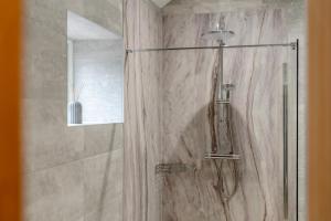 a bathroom with a shower with a glass door at 2 Bed in Crakehall oc-b30354 in Crakehall +21 photos