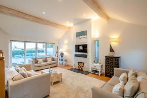 a living room with two couches and a fireplace at 5 Bed in Rock oc-m33185 in Roche
