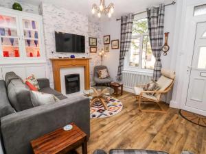a living room with a couch and a fireplace at 3 Bed in Ripon oc-t33753 in Ripon