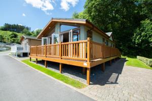 a house with a large deck on the side of a road at 2 Bed in Stepaside oc-pw9184 in Stepaside