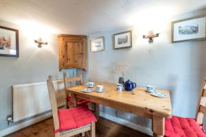 a dining room with a wooden table and chairs at 2 Bed in Castleton oc-o30120 in Castleton