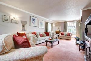 a living room with a couch and a table at 5 Bed in Kettlewell oc-ds257 in Kettlewell