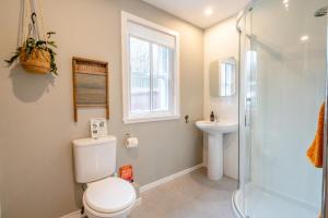 a bathroom with a toilet and a sink and a shower at 2 Bed in Dunkeld oc-i30992 in Dunkeld +24 photos