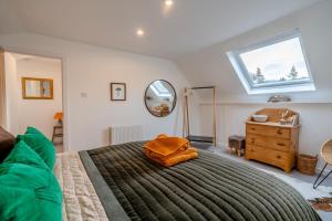 a bedroom with a large bed and a mirror at 2 Bed in Dunkeld oc-i30992 in Dunkeld
