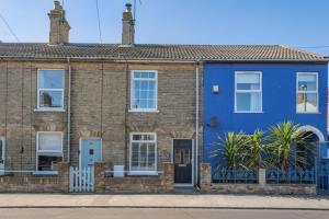 a blue house on a street at 2 Bed in Lowestoft oc-c31866 in Lowestoft