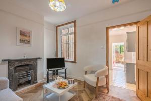 a living room with a fireplace and a tv at 2 Bed in Lowestoft oc-c31866 in Lowestoft