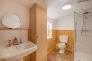 a bathroom with a sink and a toilet and a shower at 2 Bed in Lowestoft oc-c31866 in Lowestoft +14 photos