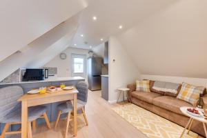 a living room with a couch and a table at 1 Bed in Booton oc-2266 in Cawston