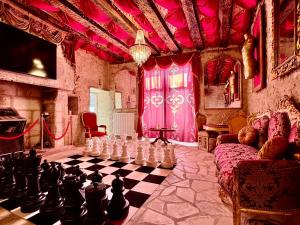 a living room with a chess board and a room with a chessboard at Caporizon - La Damoiselle in Chancelade +22 photos