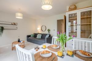 a living room with a table with food on it at 2 Bed in Mundesley oc-r31875 in Mundesley