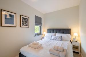 a bedroom with a bed with two towels on it at 2 Bed in Mundesley oc-r31875 in Mundesley