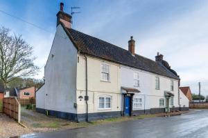 an old white house with a black roof at 2 Bed in Buxton oc-b30030 in Buxton