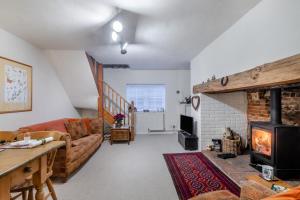 a living room with a couch and a fireplace at 2 Bed in Buxton oc-b30030 in Buxton