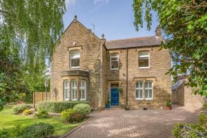 an old brick house with a blue door at 4 Bed in Beamish oc-o32025 in Beamish