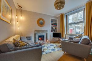 a living room with two couches and a fireplace at 2 Bed in Skipton oc-ds932 in Skipton