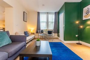 a living room with a couch and a table at Two Bed Apartment RYTON With Free Parking in Ryton