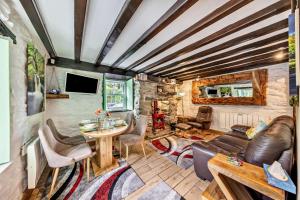 a living room with a couch and a table at 3 Bed in Fucheswen oc-c29607 in Blaenau-Ffestiniog