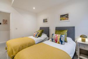 two beds sitting next to each other in a bedroom at 3 Bed in Fearnan oc-s29984 in Chesthill